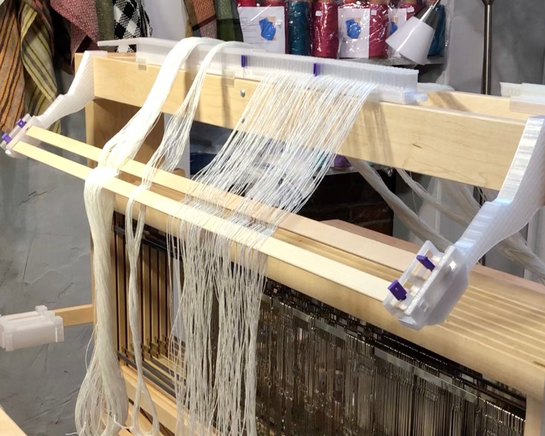 LoftyFiber Helpng Hands on a Schacht Standard weaving loom - Helpful Weaving Accessories